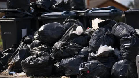 Getty Images Piles of rubbish in Birmingham