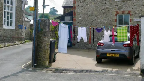 Alison Stenning Pants and pyjamas outside a house in Colyton