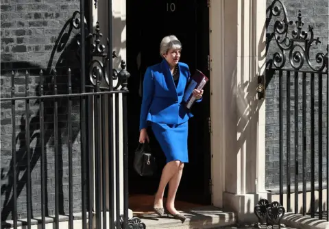 Getty Images Theresa May leaves Downing Street