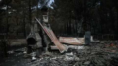 Getty Images The remains of a burnt house.