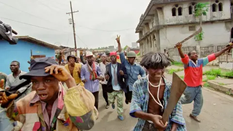 CHRISTOPHE SIMON Militiamen of National Patriotic Front of Liberia in the streets.
