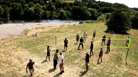 Reuters People play in the Wye at Glasbury