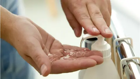 Getty Images Disinfecting hands