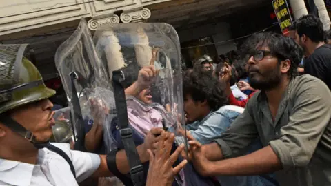 Getty Images Political party activists, different University students shout slogans and the university students tried to break the police barricades during the protest against India's new citizenship law