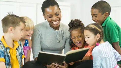 Google Woman reading to children