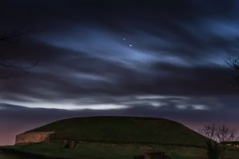 Anthony Murphy/Mythical Ireland Jupiter and Saturn pictured over Newgrange in County Meath