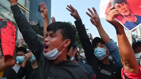 Reuters People show the three-finger salute as they rally in a protest against the military coup and to demand the release of elected leader Aung San Suu Kyi, in Yangon, Myanmar, February 8, 2021.