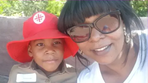 Tendayi Gwata Tendayi Gwata with her five-year-old son