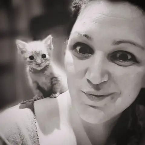 Lauren Foley Woman with a cat on her shoulder