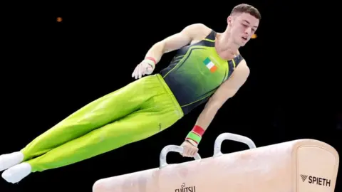 Getty Images Rhys McClenaghan in action during the pommel horse final in Antwerp on Saturday