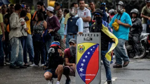 AFP Demonstrators block an avenue during an anti-government protest in Caracas on June 29, 2017