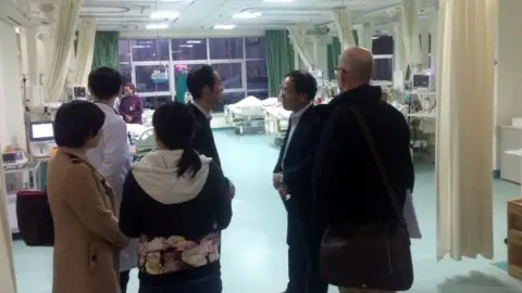 Eddie Holmes Zhang and Holmes with colleagues at Wuhan Central Hospital