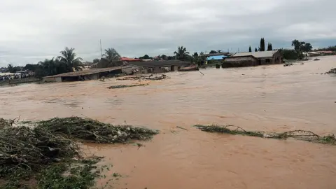 AFP This picture taken on August 27, 2011 shows floodwaters coursing through Ibadan, Odo Ona, in Oyo State.