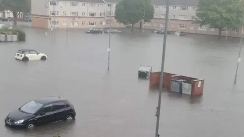 Sarah Parker Flooding around cars parked outside flats on Sandy Lane