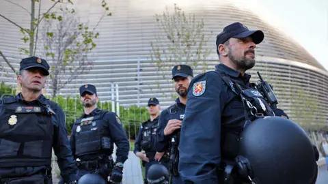 Reuters Police seen outside the Bernabeu stadium, Madrid, Spain, before a match on 9 April 2024