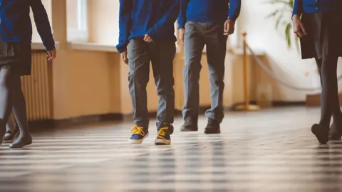 Getty Images Children in a school corridor