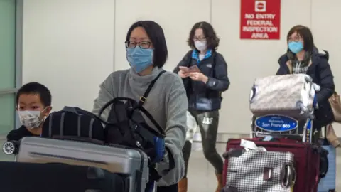 Getty Images Passengers entering US from China when restrictions were announced