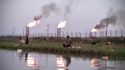 BBC News Arabic/Jess Kelly Gas flaring at an oil production site in Iraq