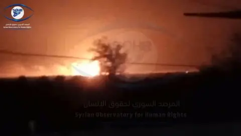 Syrian Observatory for Human Rights Screengrab of video from the Syrian Observatory for Human Rights purportedly showing an explosion caused by a US military air strike on warehouses in Ayyash, Syria (24 August 2022)