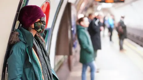 Reuters People social distancing on a tube platform