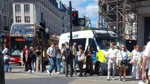 A police van parked next to the entrance to Oxford Street Tube station