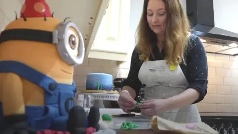 A Gloucester cake maker in her kitchen