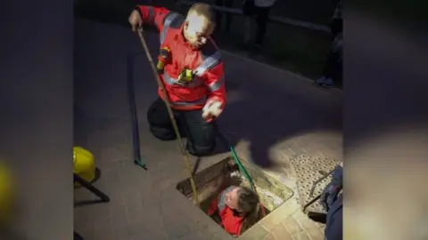 Cambs Fire and Rescue Cat being rescued