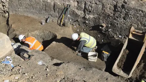 Thousand Word Media  Archaeologists at work on site at the Forum