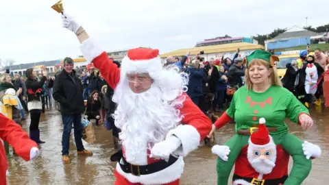 Wales News Service Santa and his helper