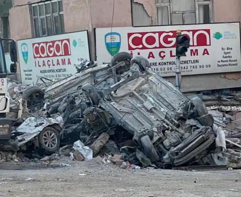 K9 Search & Rescue NI Overturned cars amid the wreckage and devastation caused by the earthquake in Adana