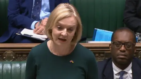 PA Media Prime Minister Liz Truss speaking in the House of Commons, flanked by Mr Kwarteng