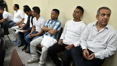 AFP Sergio Rodriguez (R), and others wait to hear their sentence at a courtroom in Tegucigalpa on November 29, 2018