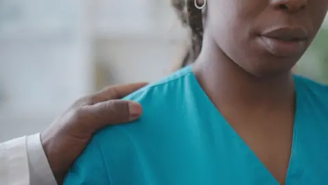 Getty Images A physician harassing a colleague