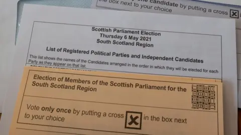 Getty Images Postal vote papers for the Scottish election