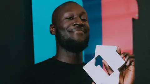 PA Stormzy with number one sign