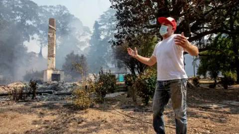 Getty Images Hundreds of buildings have burnt including this historic 157-year old farmhouse