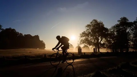 PA Media A cyclist in London's Richmond Park