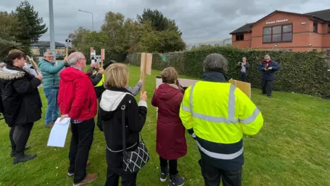 Campaigners protest in front of MS3 Networks' offices