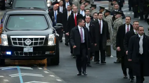 Getty Images Secret Service protection agents around the president's limousine