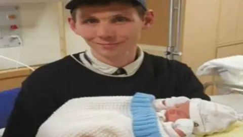 Alex Moss James Rudd with his son