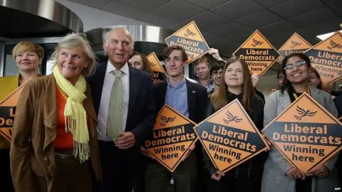 AFP Sir Vince Cable poses with Liberal Democrat activists