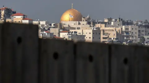 AFP The Dome of the Rock seen from the Palestinian village of Abu Dis in the occupied West Bank (29 January 2020)