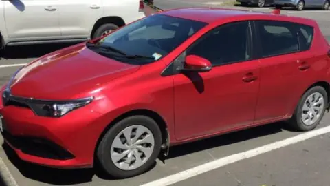 New Zealand Police a 2016 red Toyota Corolla hatchback