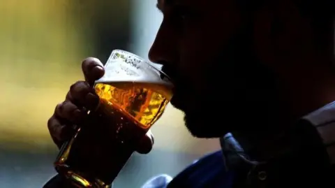 PA Man drinking pint