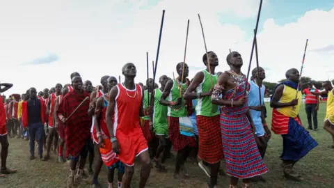 EPA Maasai warriors in their traditional attire sing as they warm up before the start of the games