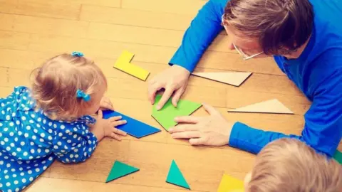 Child and father playing