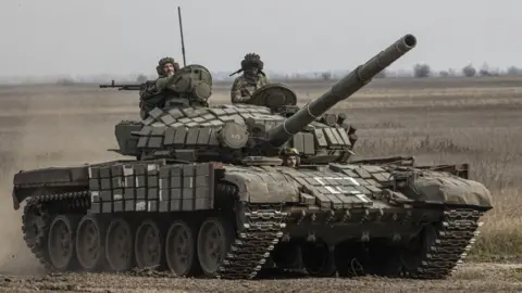 Getty Images A Ukrainian tank moves forward in an advance on the city of Ukraine