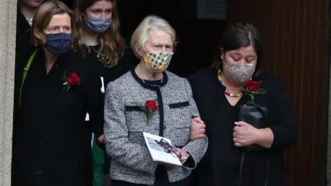 Niall Carson Pat Hume and her daughter Mo leaving the cathedral together.