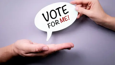 Getty Images Vote for me label