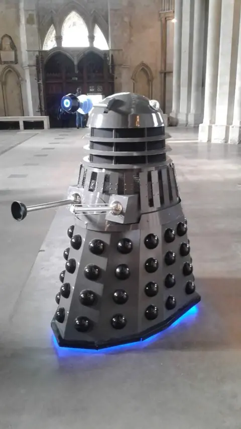 Louise Cook Dalek in an abbey